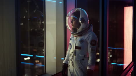 astronaut gazing at city lights