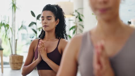 women meditating in a yoga studio