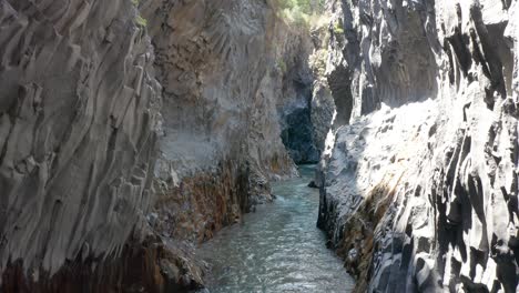 flying inside alcantara river gore in sicily without people