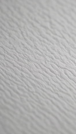 white textured background with subtle ripples