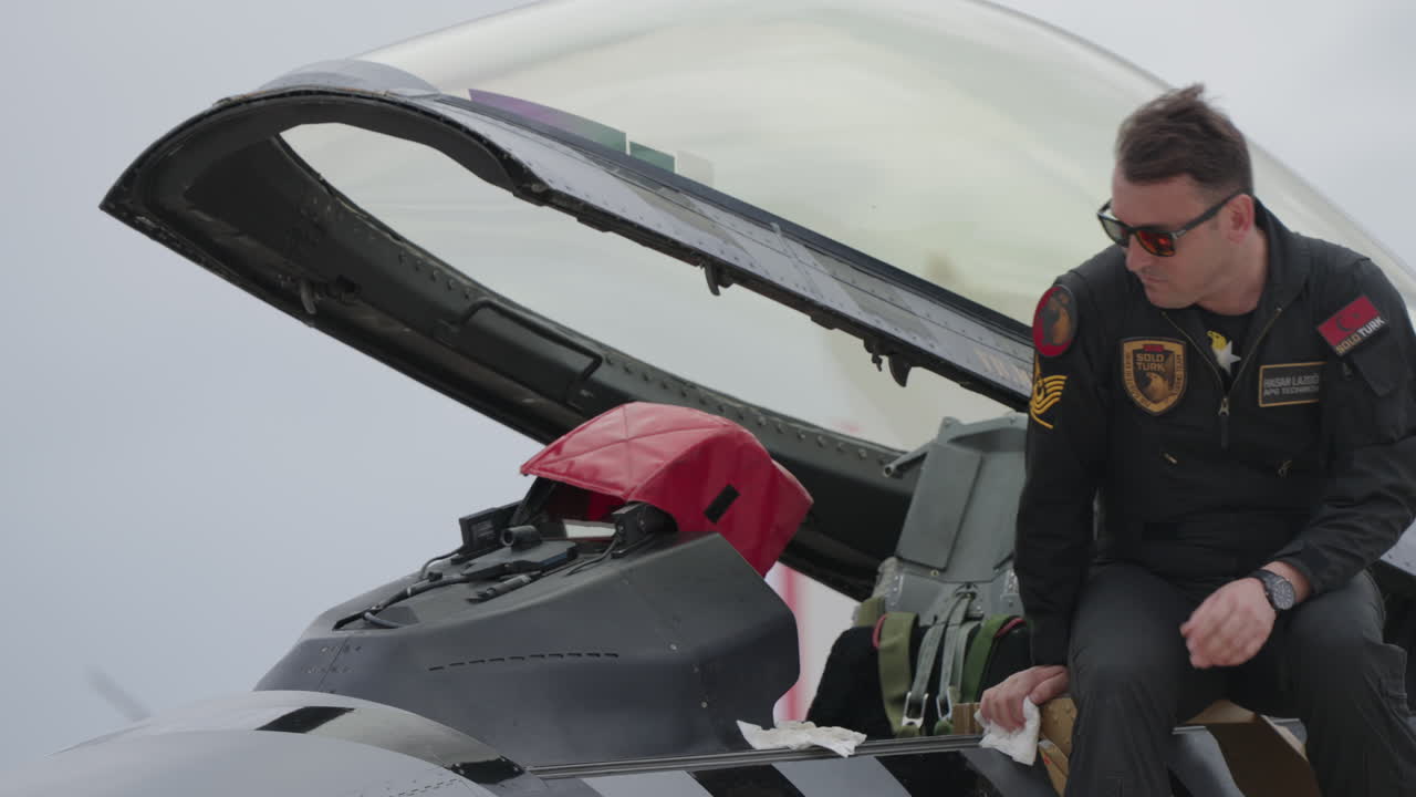 Pilot Getting into Fighter Jet Cockpit for Pre-Flight Checks