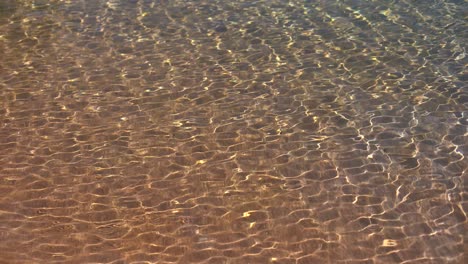 Soft-wave-of-the-sea,-beach-sand-texture