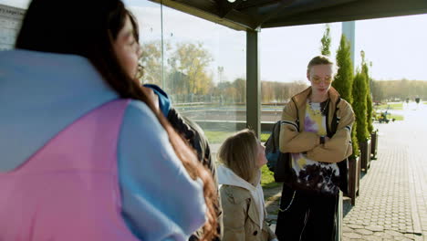 young people at bus stop