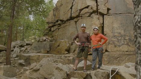 climbers at the bottom of the cliff