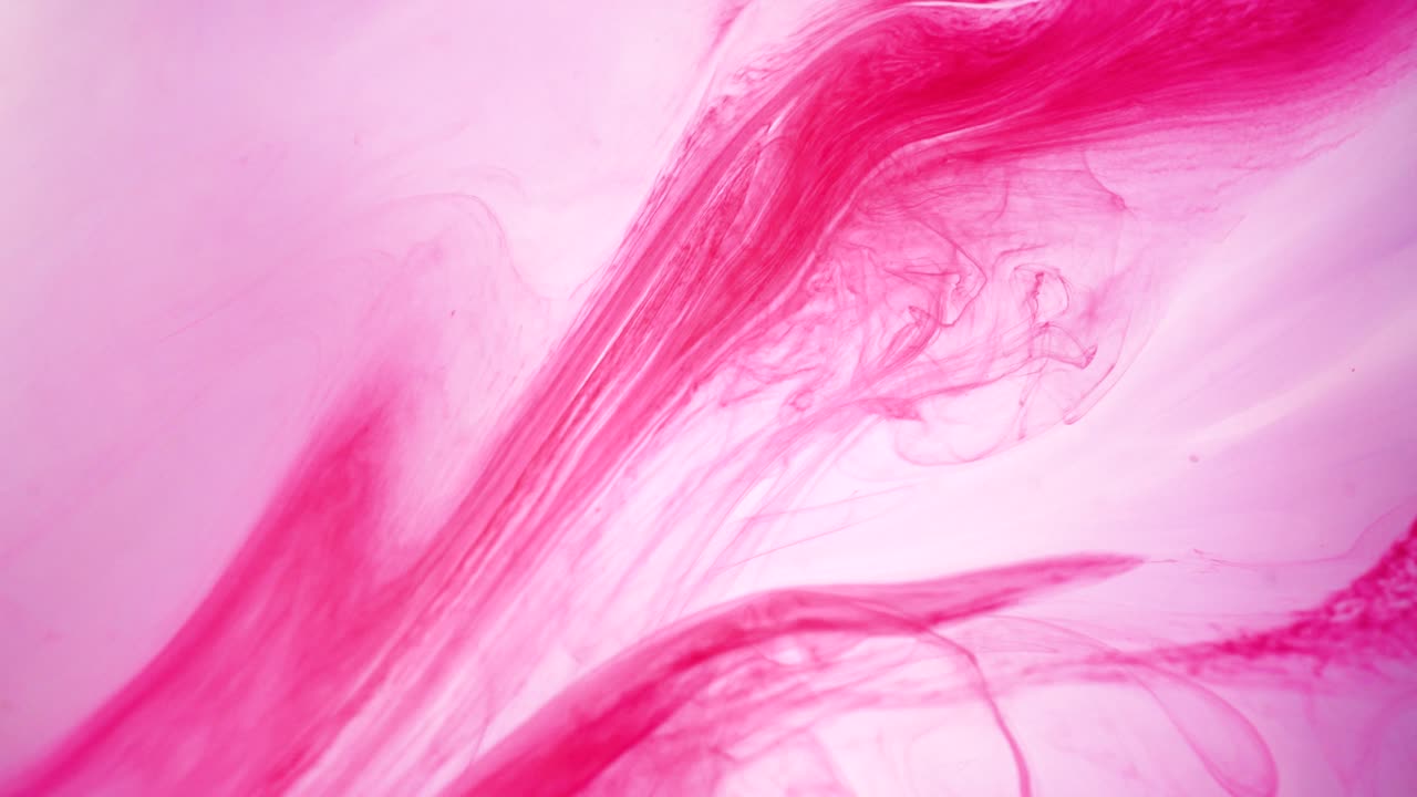 fondo abstracto rojo, pintura de color rosa en el agua con telón de fondo, vista macro 4k, movimiento de fondo colorido interesante