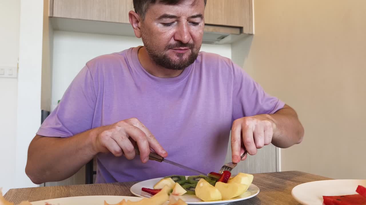 Man eating fruit