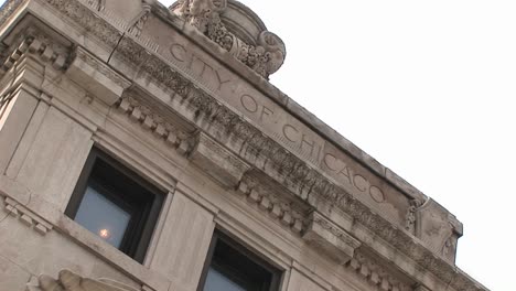 An-Angled-Shot-Of-A-Building-Facade-Includes-The-Words-City-Of-Chicago""-On-It""