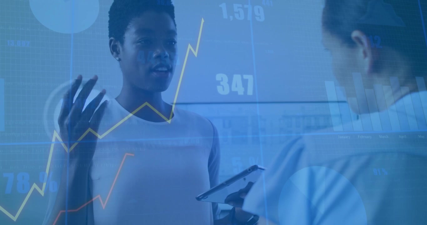 Business team presenting in meeting room, colleague using tablet showing floating digital graphs