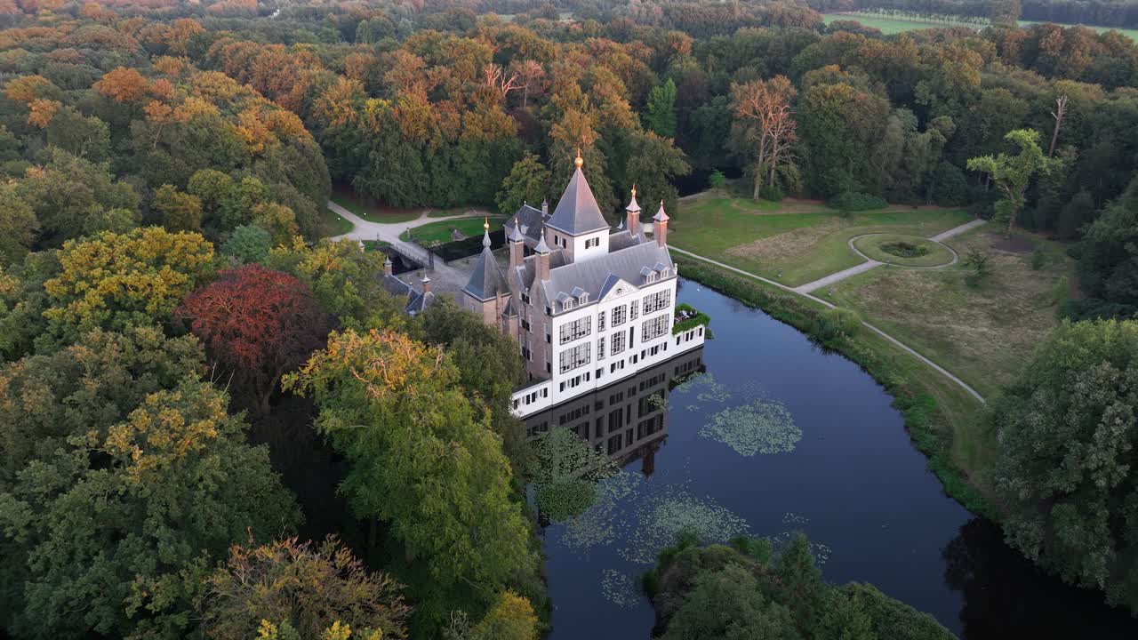 Renswoude castle, The Netherlands romantic historic castle in forrest nature. Aerial drone video.
