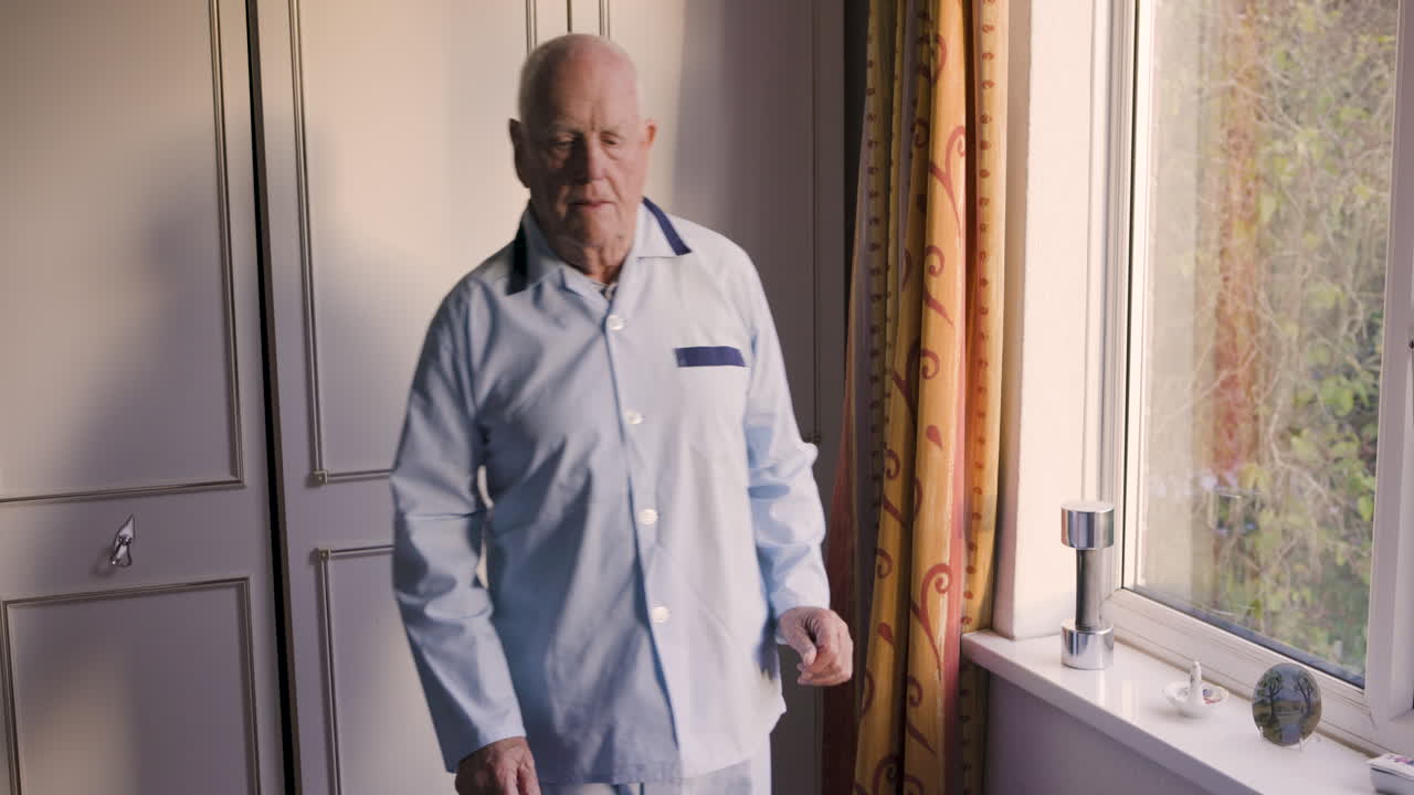 Man in pajamas in a room