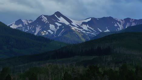 Mt-Sopris-Sopras-old-mount-Snowmass-Resort-Colorado-aerial-drone-sunset-Aspen-Wilderness-summer-June-July-Rocky-Mountains-peaks-farmland-landscape-sunny-blue-sky-Capital-Peak-upward-motion