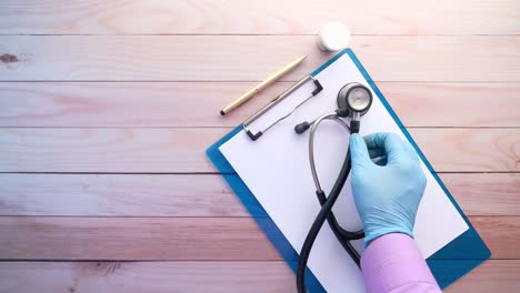 medical exam with stethoscope and clipboard