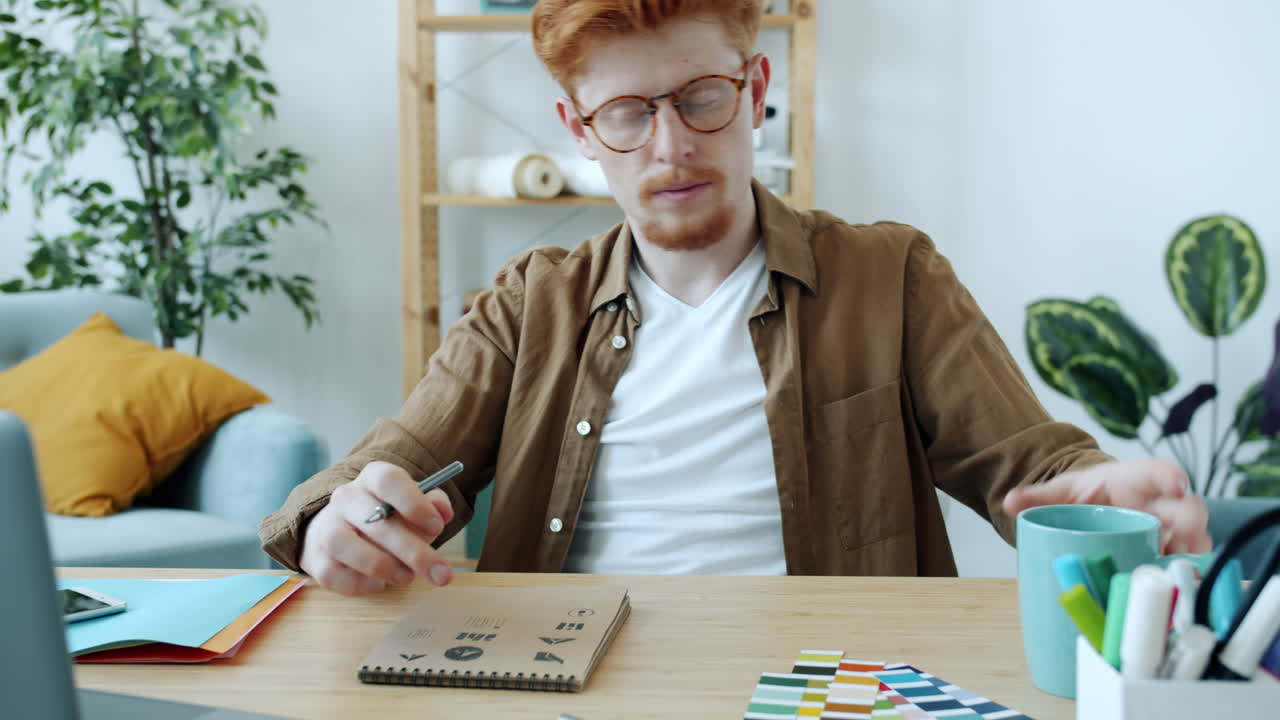 Man working on design project at home