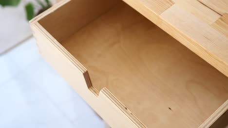 close up of an open wooden drawer