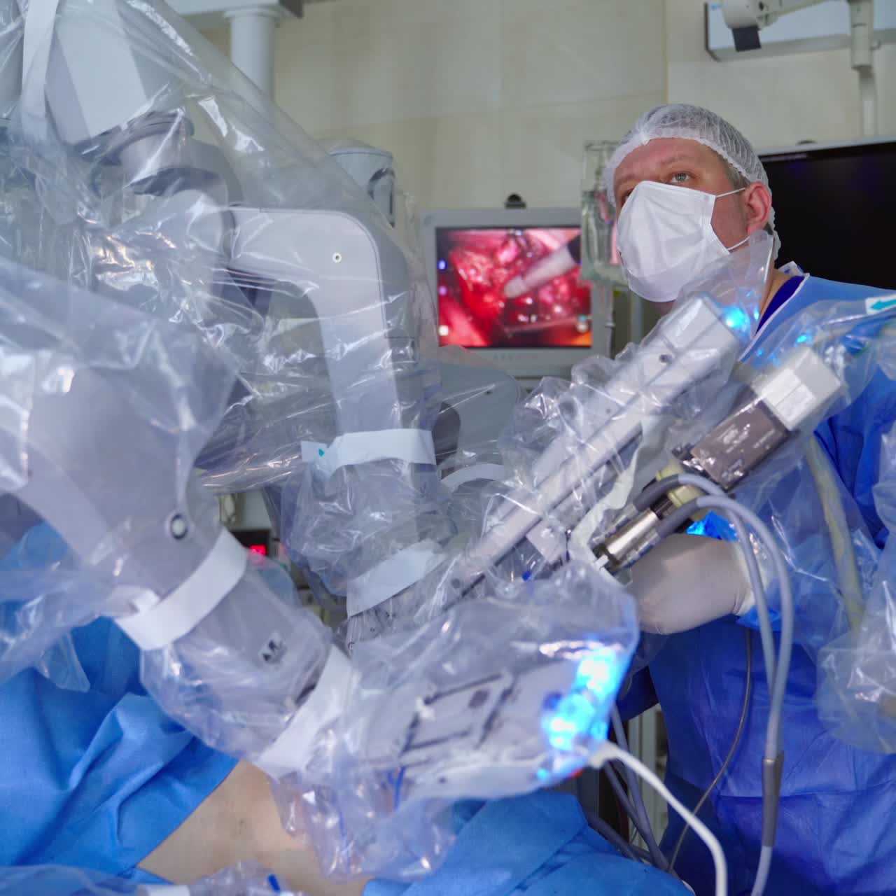 Surgeon in futuristic operation room. Automation robot hand machine in operating room and surgery doctors in futuristic hospital