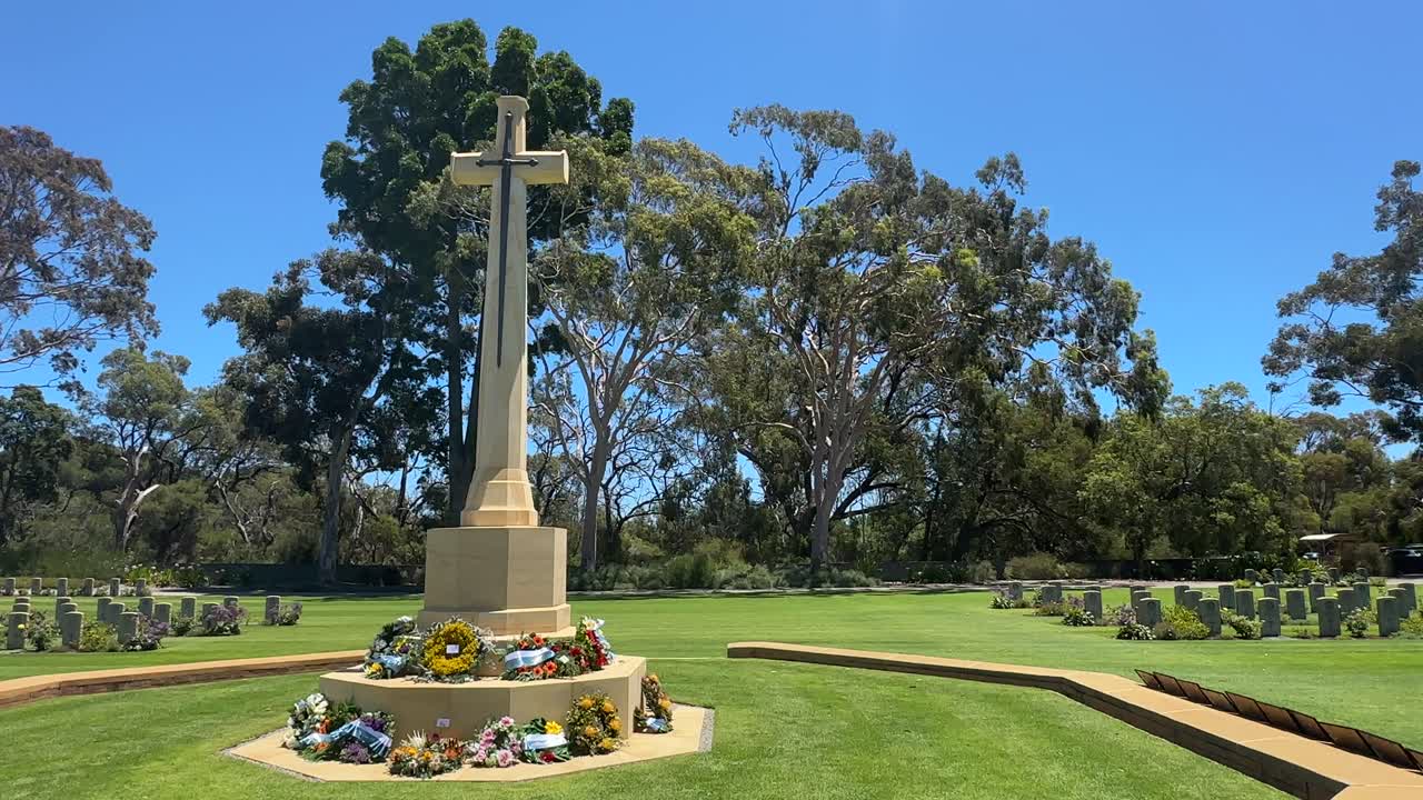 ANZAC War Memorial cross monument flower wreaths lawn gum trees Nedlands Perth WA