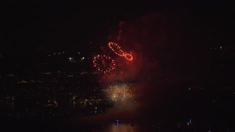 static view of nighttime fireworks show seen from the air, dark