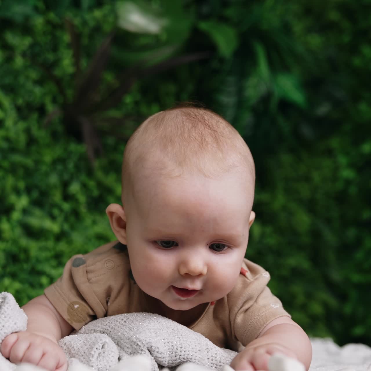 funny little newborn baby on nature lying. Smiling baby portrait lifestyle