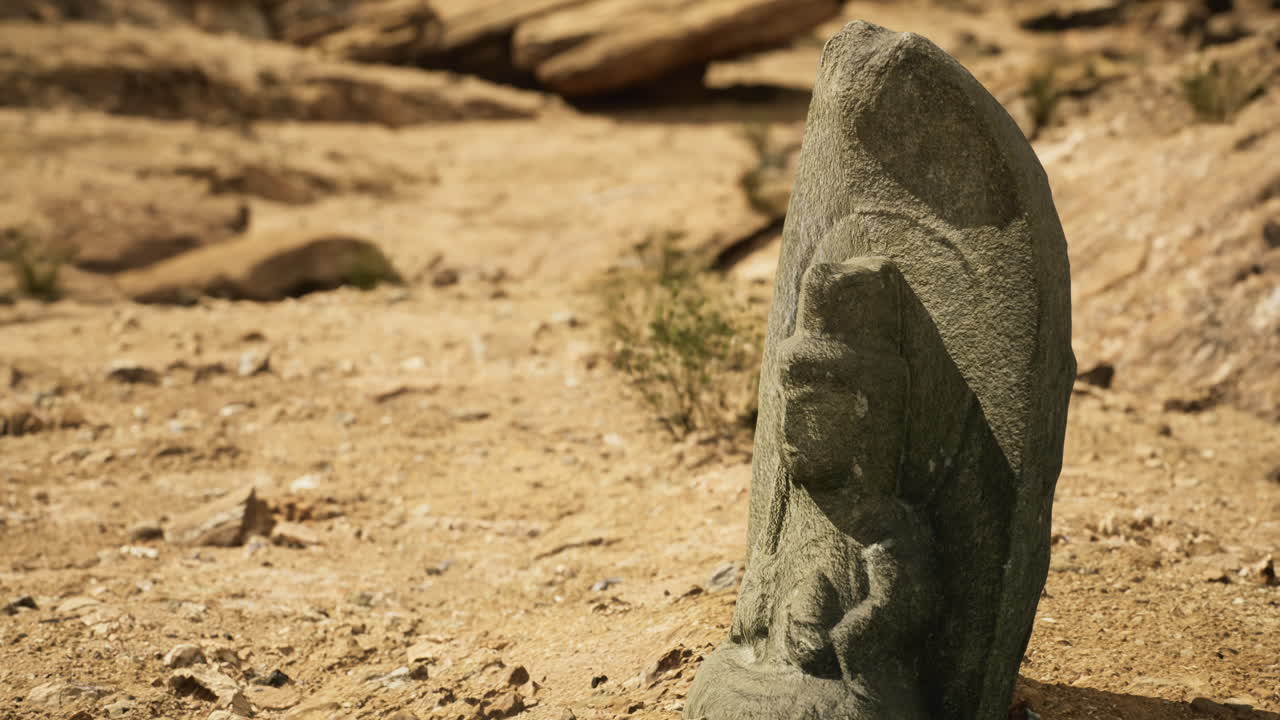 Ancient stone carving in a desert landscape showcasing intricate details