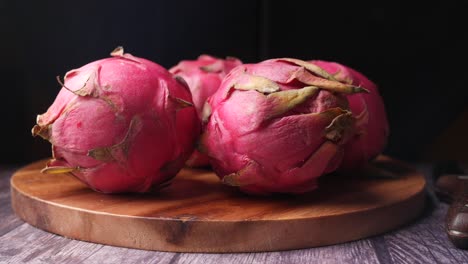 close-up of dragon fruit on wooden cutting board