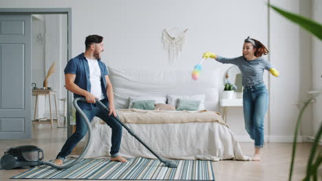 couple having fun while cleaning