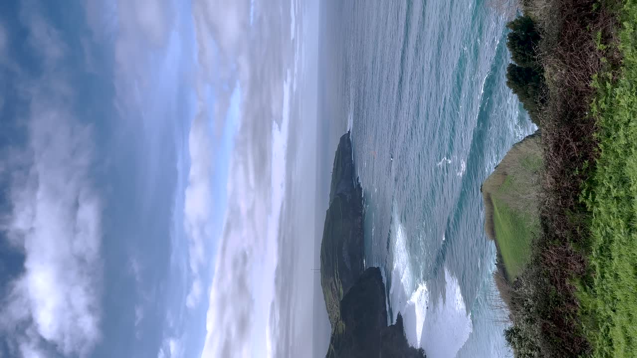 Aerial forward view of a beautiful seascape in a wild environment