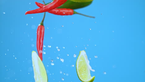 red hot chili bell peppers, lime, green and yellow peppers flying in air