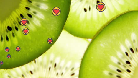 animation of heart icons over kiwi fruit