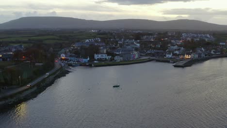 Ascending-aerial-of-Kinvara-town-at-twilight