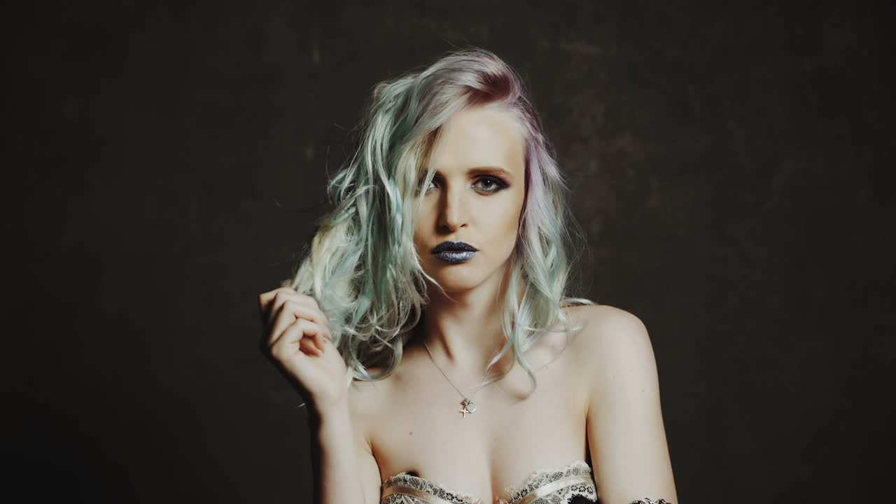 Portrait of a Beautiful Girl with Dyed Hair. Beauty fashion model girl with colorful dyed hair. Colourful long hair.