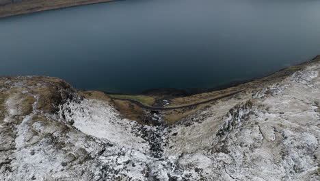 Faroe-Islands,-4K-Aeria-wide-and-tilt-down-to-reveal-beautiful-Fossá-waterfall