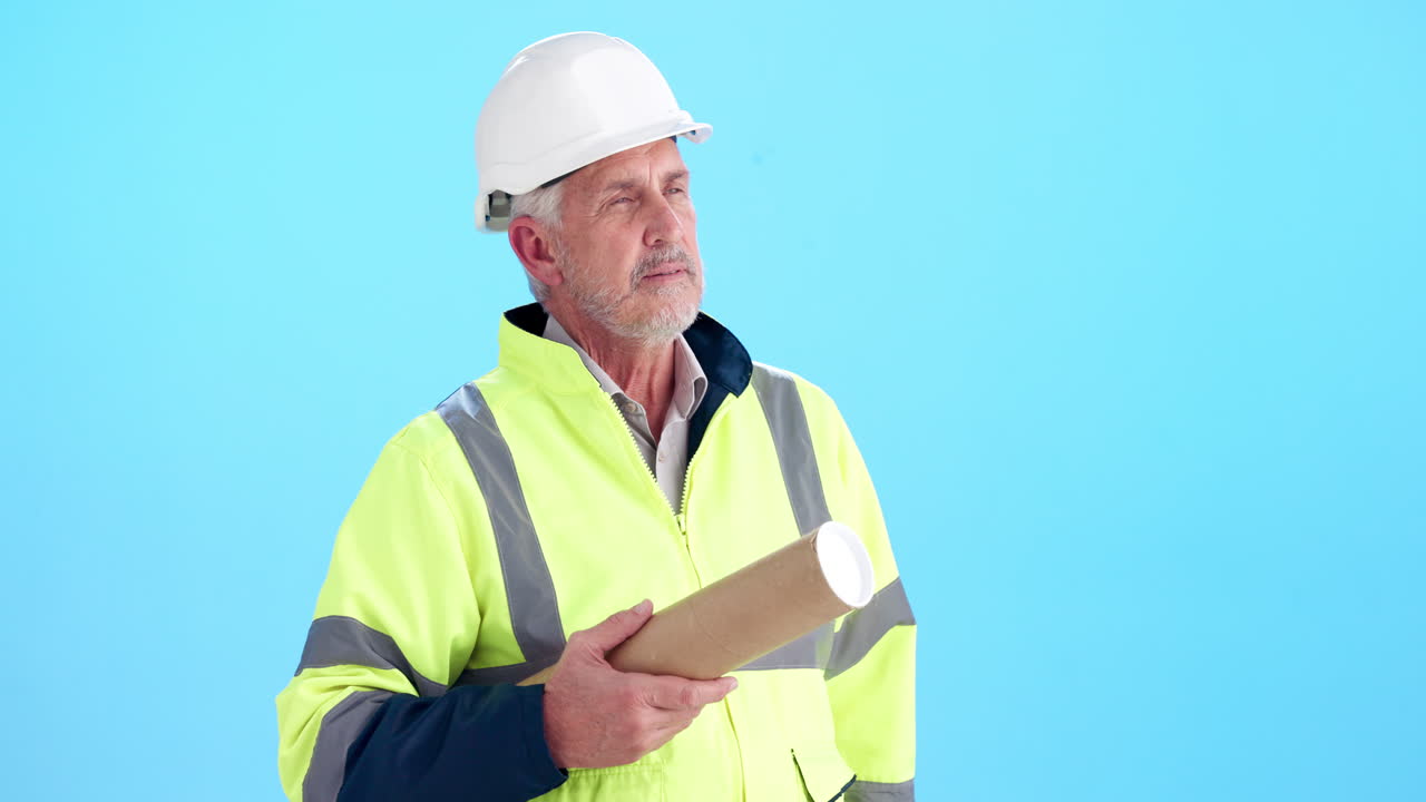 Construction worker with blueprint