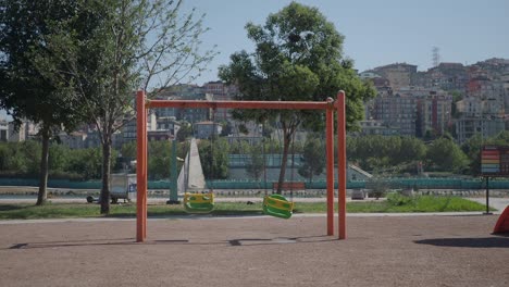 empty swing set in a city park