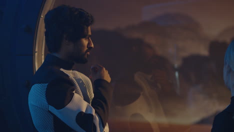 two people in a spaceship discussing