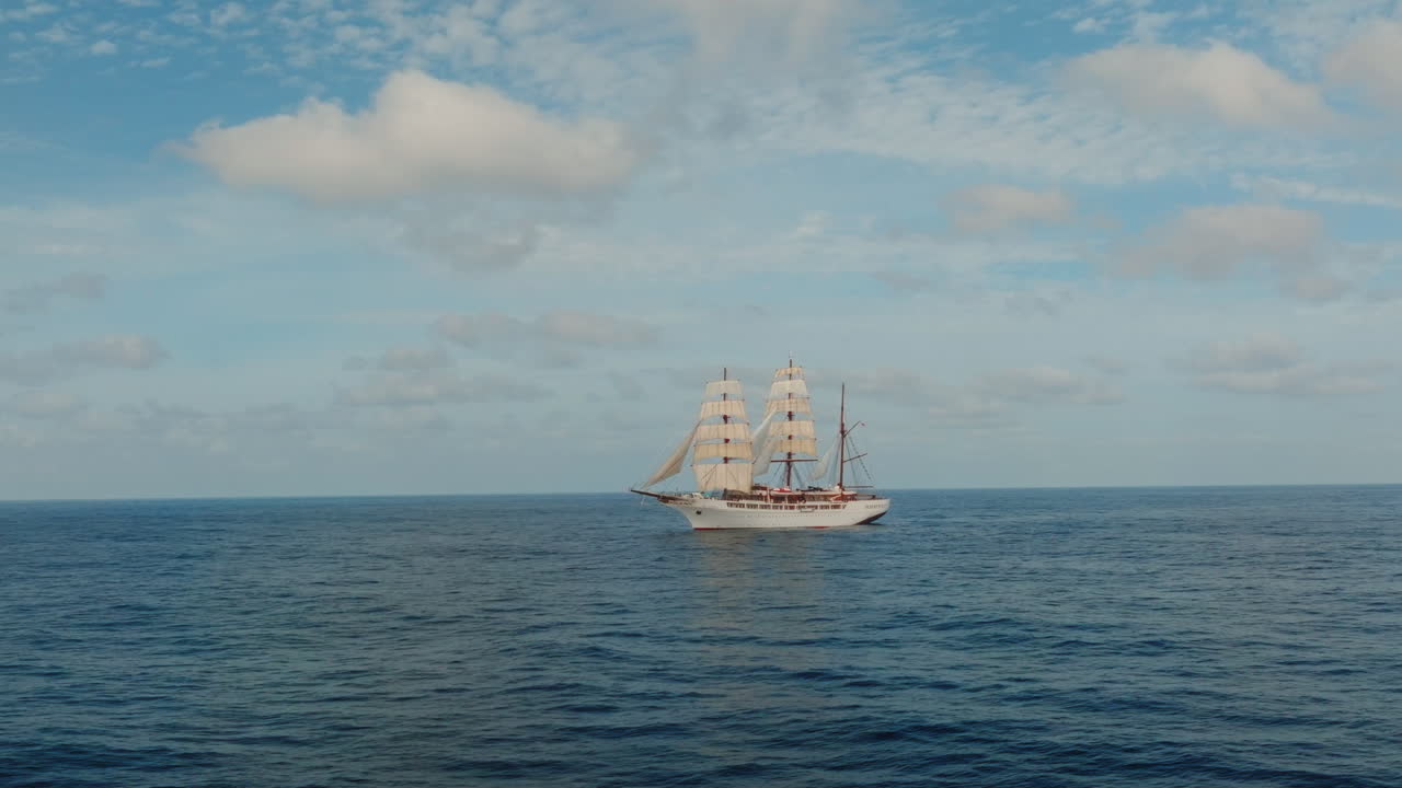 Sea cloud luxury cruise ship sailing vessel in the Atlantic Ocean under clear daylight, Drone view