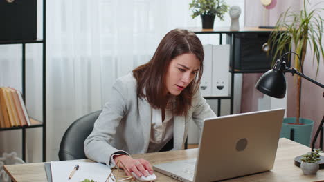 business woman using laptop typing browsing bad news fortune loss fails at home office workplace