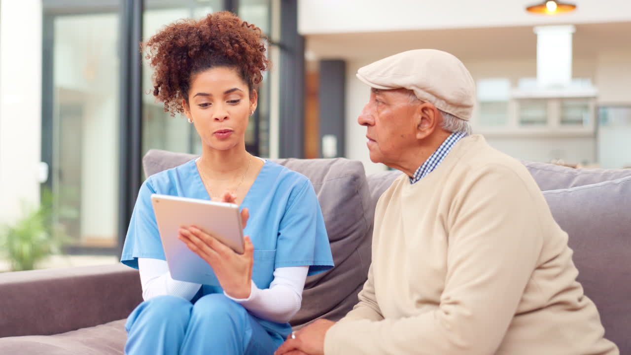 Nurse Consults Senior Patient