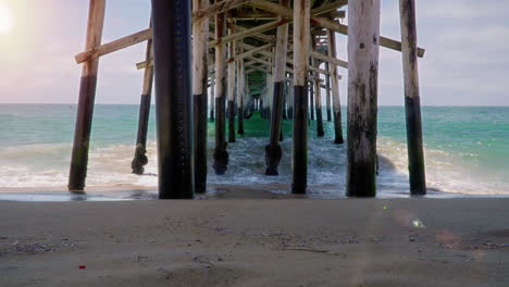 time lapse of waves under pier in new port beach, california