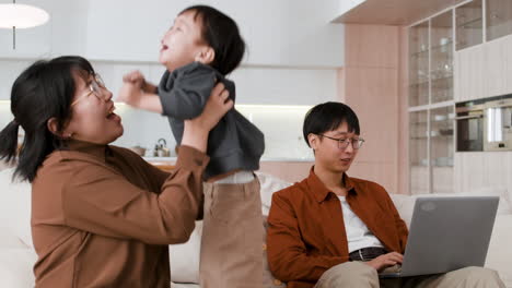 family at home - mom, dad, and baby