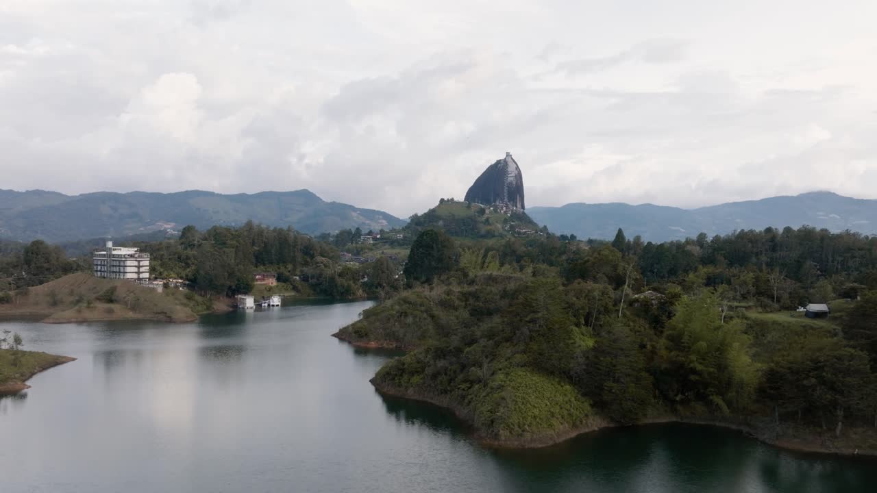 Drone shot of El Peñón de Guatapé (La Piedra Rock) with lakes and mountains