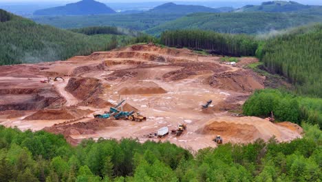 A-punched-in-aerial-shot-of-Mining-in-a-forest