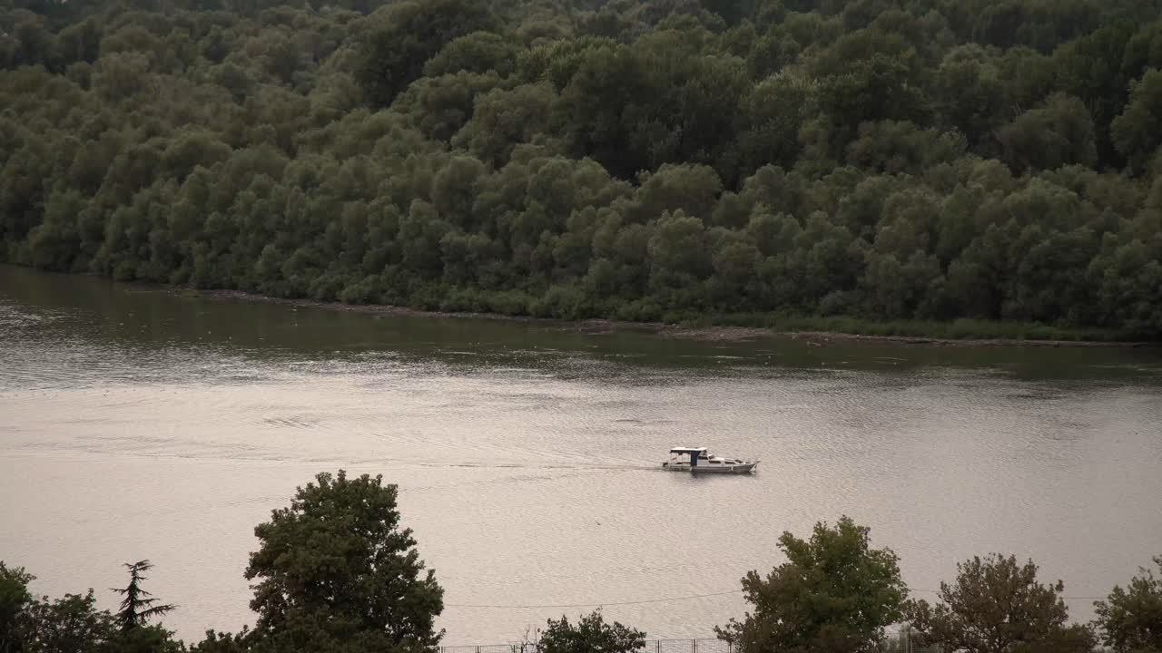 Motor boat traveling down the Danube in Belgrade, Serbia