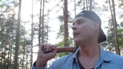 man with axe in forest