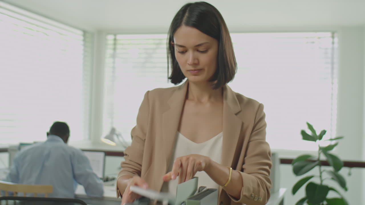 Businesswoman Packing Office Stuff After Getting Fired