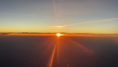 spectacular sunset as seen by the pilots with sunbeams while flying westbound at 10000m high