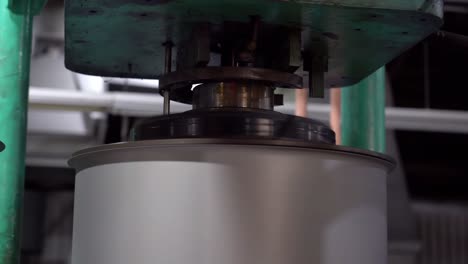 each drum can is fitted with a motorized machining tool to ensure its precise size