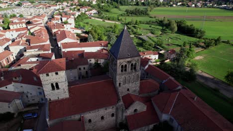 aerial shot revealing saint andré church in saint just saint rambert city center, loire departement, auvergne rhone alpes region, france