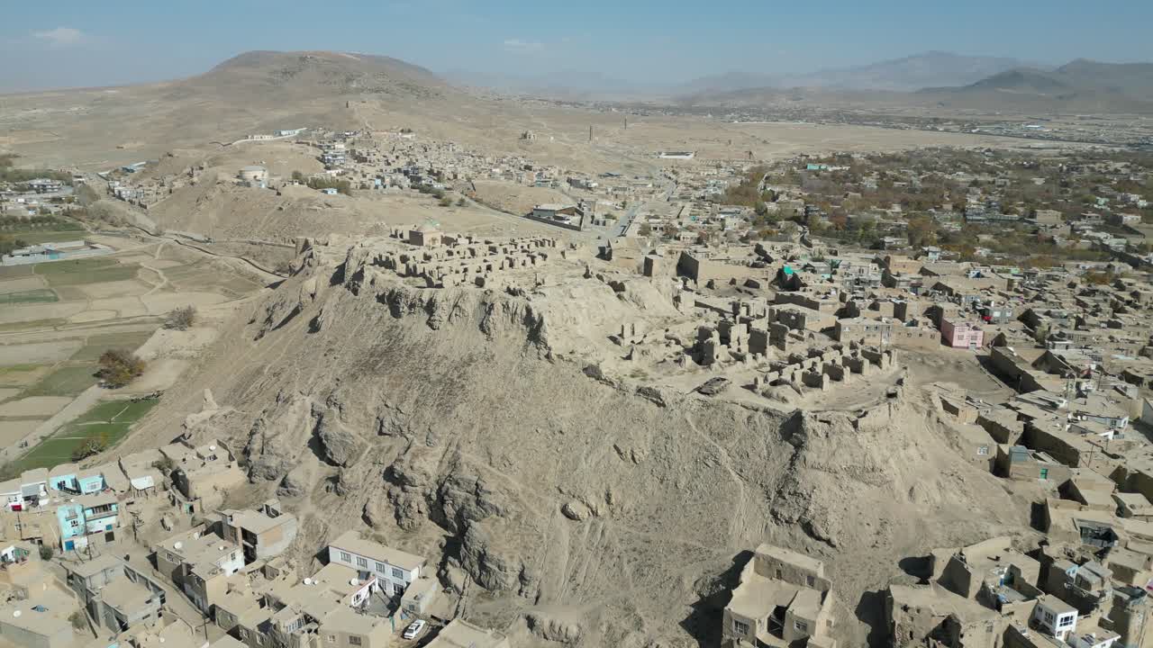 Ghazni Drone Aerial View of Historic Citadel fortress , Street Traffic, City Buildings and Homes, Afghanistan