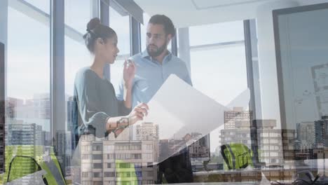 Animation-of-cityscape-over-diverse-male-and-female-business-colleagues-talking-in-office