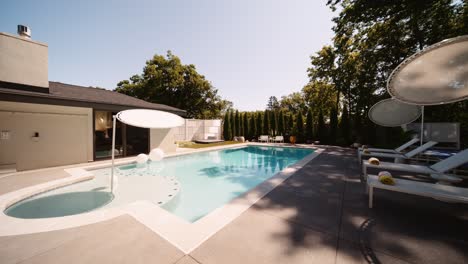 push in shot of a pool area in the backyard of a luxury home